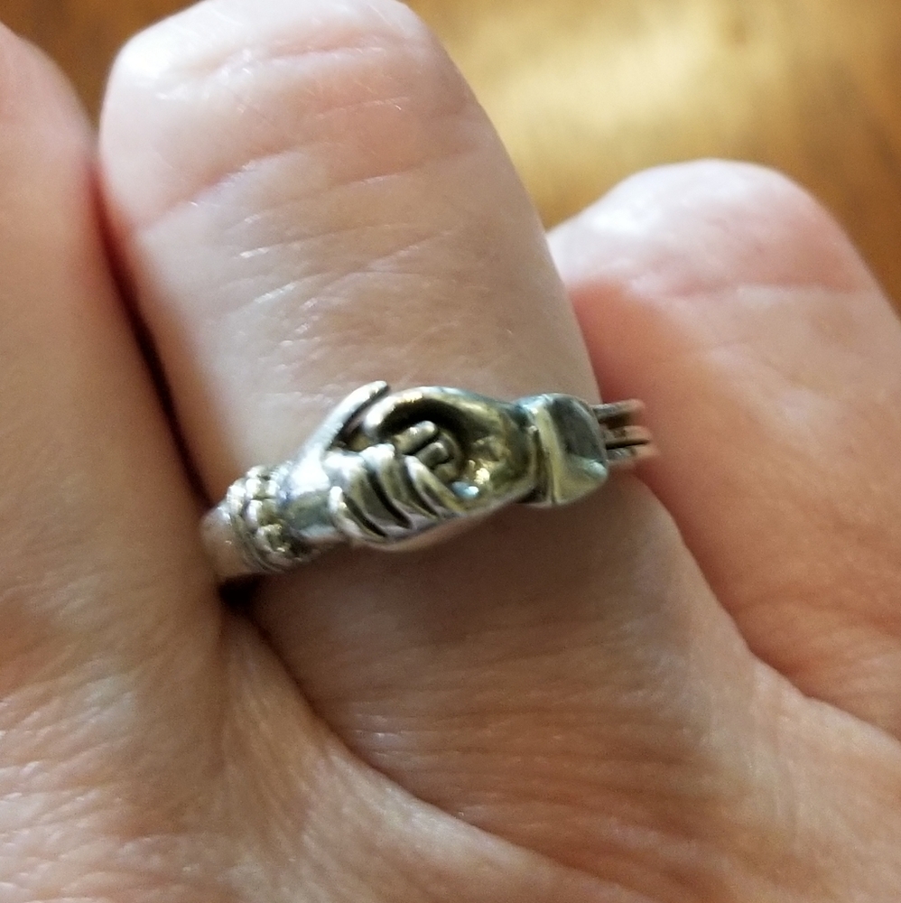 Sterling clasping hands ring
